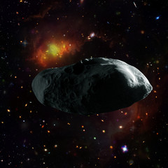 Asteroid flying in the deep space. Galaxies and stars. Elements of this image furnished by NASA.