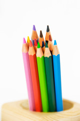 colorful wooden pencils for drawing on white background