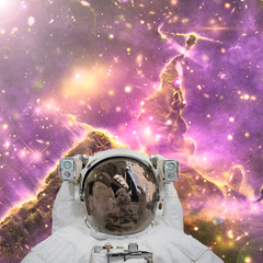 Closeup of astronaut. Galaxy on the background. The elements of this image furnished by NASA.