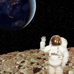 Astronaut on the moon. Blue fascinating earth on the background. Elements of this image furnished...