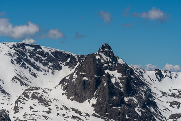 Landscape of black snow dappled mountain tops at Rocky Mountain National Park