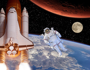 Rocket flies from earth to Mars. Astronaut and moon in the distance. The elements of this image...