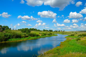 Fototapeta na wymiar Sunny summer landscape with river and fields