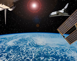 Shuttle flies in space. Other spaceship goes anywhere.  The elements of this image furnished by...