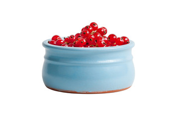 Red garden currants in a clay cup