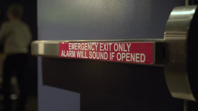 Emergency exit only door with posted sign 4k