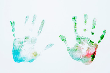 Close up of colored hand print of happy child on white background