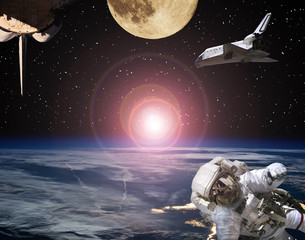 Astronaut, spaceships and moon. Sunrise on the backdrop. The elements of this image furnished by...