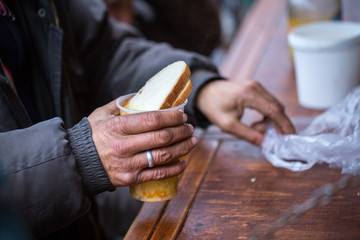 Charity. The fight against poverty. Volunteers handed out hot meals to people in need. Cold winter...