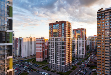 view of modern multistorey buildings in St. Petersburg at sunset against the sky