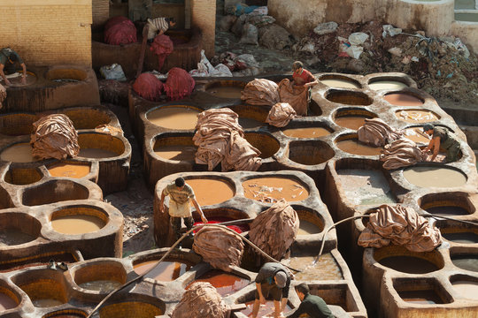 The tanneries are located in the medina of Fez, Morocco. It's a hard labour for the workers in a very smelly environement in Fes