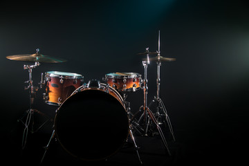 drum set on a black background with a beautiful soft light