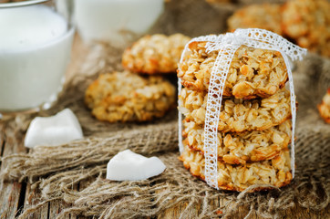 Oatmeal coconut cookies on a wood background