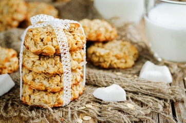 Oatmeal coconut cookies on a wood background