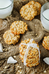Oatmeal coconut cookies on a wood background