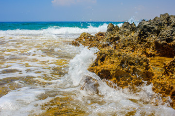 pristine seascapes with crystal clear blue water and yellow rocks in Ayia Napa, Cyprus