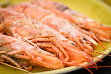 grilled shrimps with lemon juice and olive oil - fresh seafood dish 