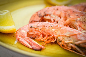 grilled shrimps with lemon juice and olive oil - fresh seafood dish 