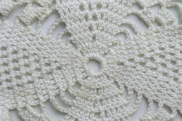 Knitted cloth on white background, close up
