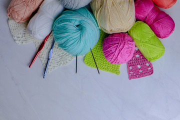 Composition with colorful yarn on light background	
