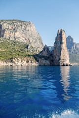 The monolith of Pedra Longa, Baunei, province of Ogliastra, East Sardinia, Italy. The rocky spire which rises majestically out of the sea. Holidays in Sardinia.