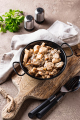 Stewed chicken fillet with mushrooms