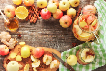 ingredients for refreshing drink, apples, ginger, lemon, honey, spices