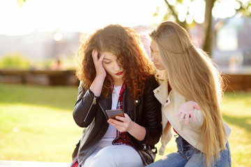 Young woman support and soothe her upsed friend. Two girl during the conversation.