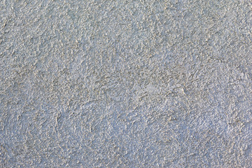 Surface of rough taupe grey concrete ог mortar wall