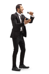 Young man singing on a microphone