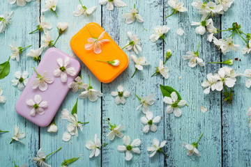 soaps with cherry flowers on old blue wood table