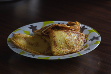 plate with fried thin pancakes