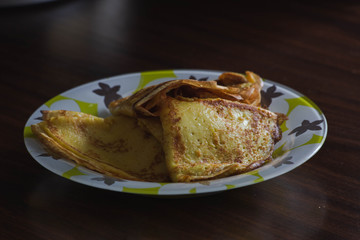 plate with fried thin pancakes