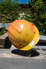 Old orange construction helmet close-up