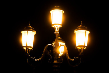 black iron street lamp at night