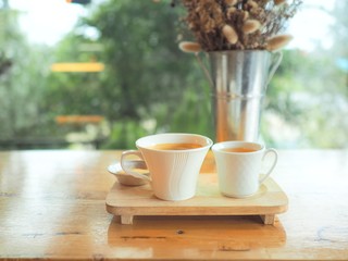 cup of coffee on wooden table