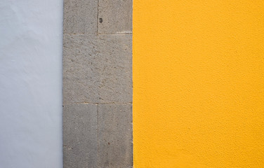 Fototapeta premium Wall panels in gray and yellow colors, detail of modern house finish.