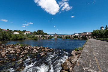 Fototapeta premium View of the traditional village of Ponte da Barca in the Minho Region of Portugal, with the Lima River and the old bridge.