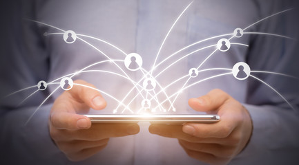 Man using digital tablet with social icons, worldwide networking