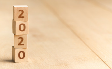 Wooden blocks with 2020 numbers standing on the floor