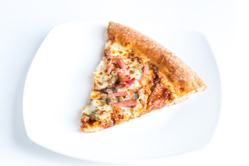 Slice of barbeque meat pizza on a plate.