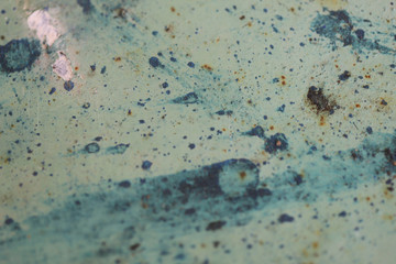 Fototapeta na wymiar Background texture of an old painted surface with blue spots. Cropped shot, horizontal, free space, close-up. Concept of design.