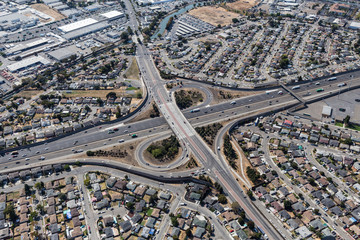 Aerial view of streets, buildings and traffic along the 880 freeway at 98the Ave in Oakland California.