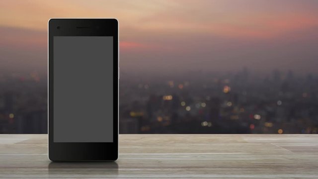 cctv camera flat icon on modern smart mobile phone screen on wooden table over blur of cityscape on warm light sundown, Business security and safety online concept