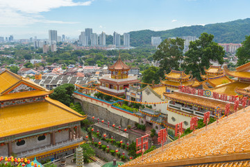 Yellow roof of Kek Lok Si Temple with Penang cityscape in Penang island, Malaysia