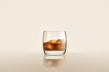 glass with whiskey and ices