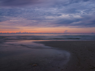 sunset on the beach at hua-hin thailand