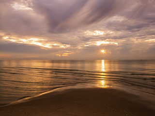sunset on the beach at hua-hin thailand