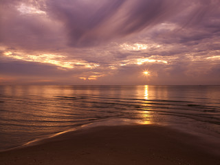 sunset on the beach at hua-hin thailand