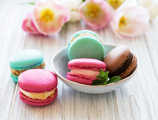 Colorful macaroons and tulips